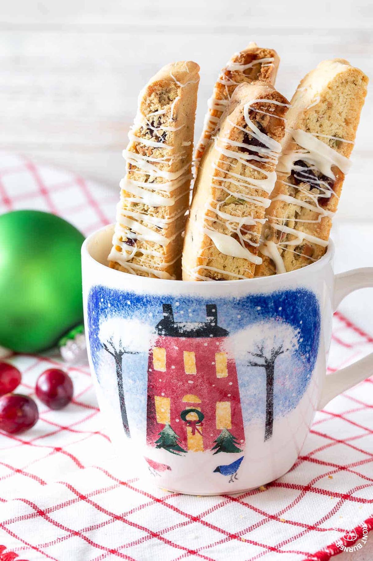 Cranberry Pistachio Biscotti drizzled with White Chocolate