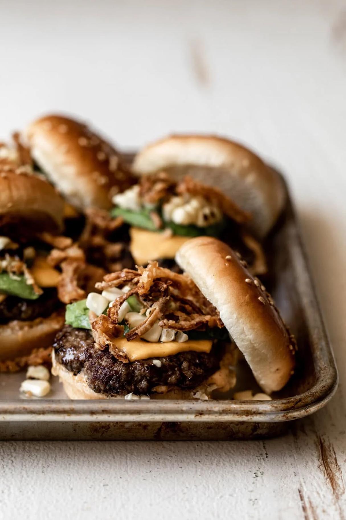 Corned Beef Sliders with Chipotle Mayo, Spicy Jalapeno, and Crispy Onion Strings